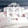 Silver laser cut wedding invitations featuring a heart-shaped floral arch and elegant typography