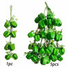 A sprig of artificial green fruits and vegetables, showing 1 piece and a cluster of 5 pieces.