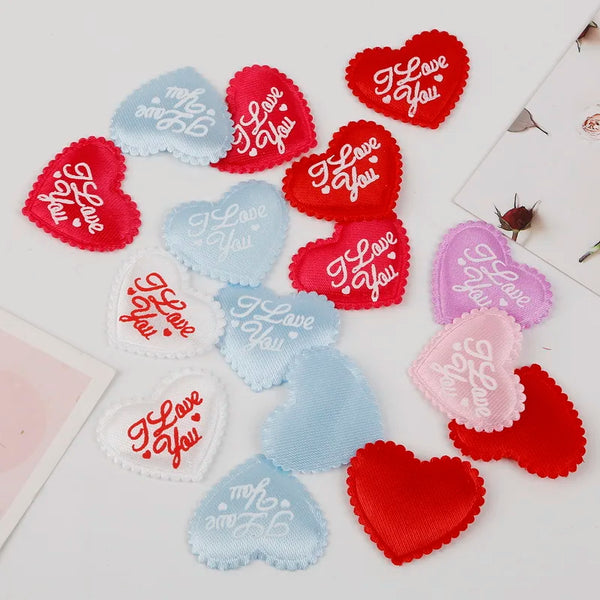 Assortment of heart-shaped sponge confetti in red pink and blue colors for weddings and celebrations