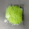 A clear plastic package containing a 50-pack of neon green glow-in-the-dark star wall stickers.