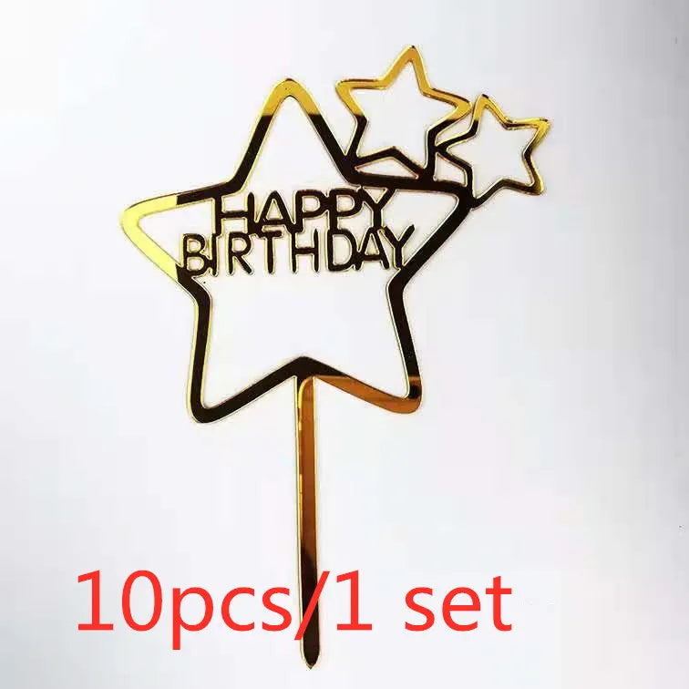 A set of ten gold acrylic star birthday cake toppers with the words happy birthday