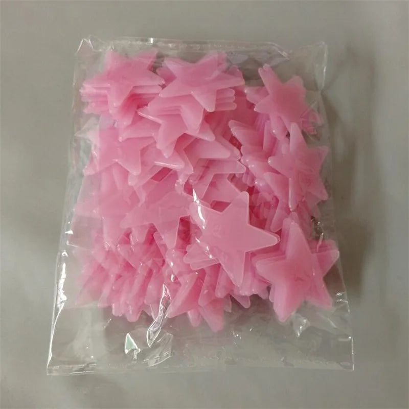 A clear plastic bag containing a pack of pink glow-in-the-dark star wall stickers.