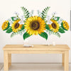A floral wall decal featuring yellow sunflowers and green foliage on a white background.