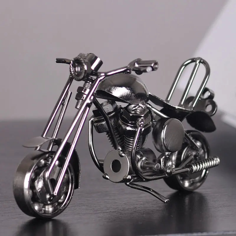 A handcrafted metal motorcycle model featuring vintage diecast details and chrome finish.