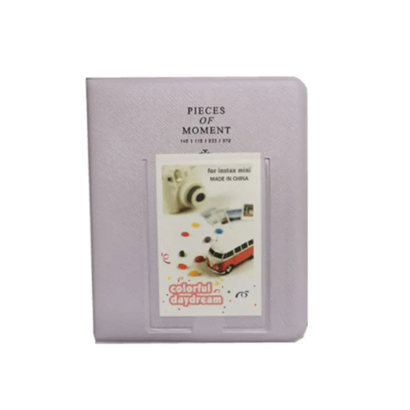 A lavender compact photo album titled Pieces of Moment for instant film, featuring colorful dream imagery.