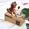A small robotic dog figurine in brown and white is placed on a cardboard box labeled CHOKEN-BAKO.