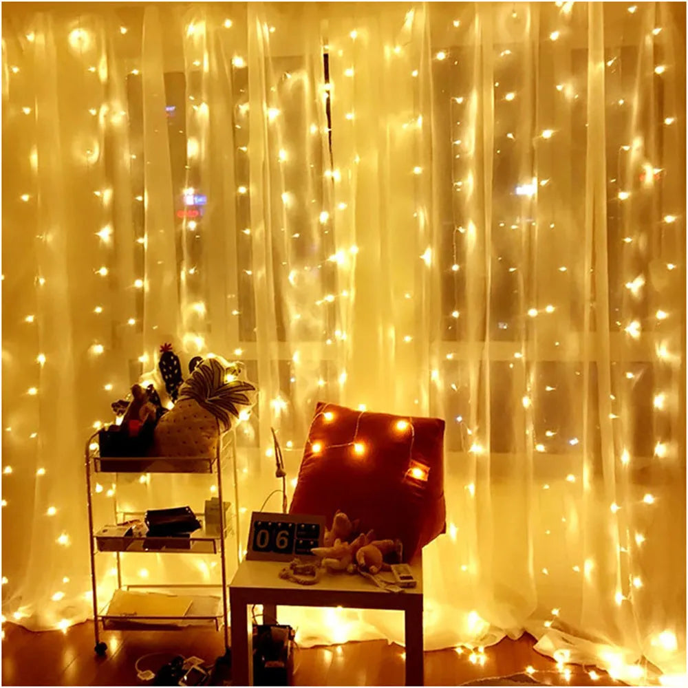 Outdoor LED string lights draped behind sheer yellow curtains with decorative elements.