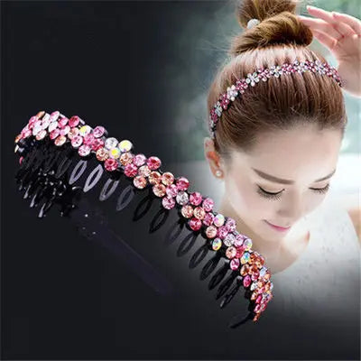 A woman is wearing a sparkling crystal rhinestone headband woven into her hair.