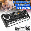 A black electronic keyboard with 61 keys and a microphone is shown on a desk.