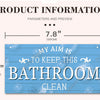 A rustic wooden sign with the text "MY AIM IS TO KEEP THIS BATHROOM CLEAN" on a blue background.