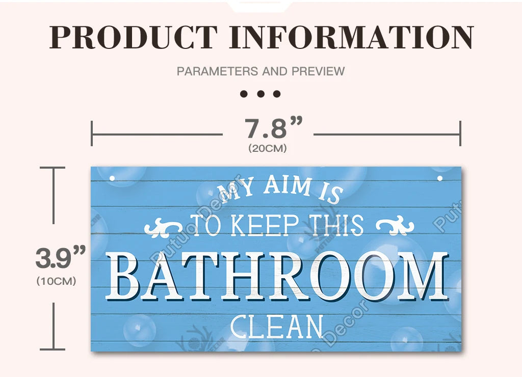 A rustic wooden sign with the text "MY AIM IS TO KEEP THIS BATHROOM CLEAN" on a blue background.