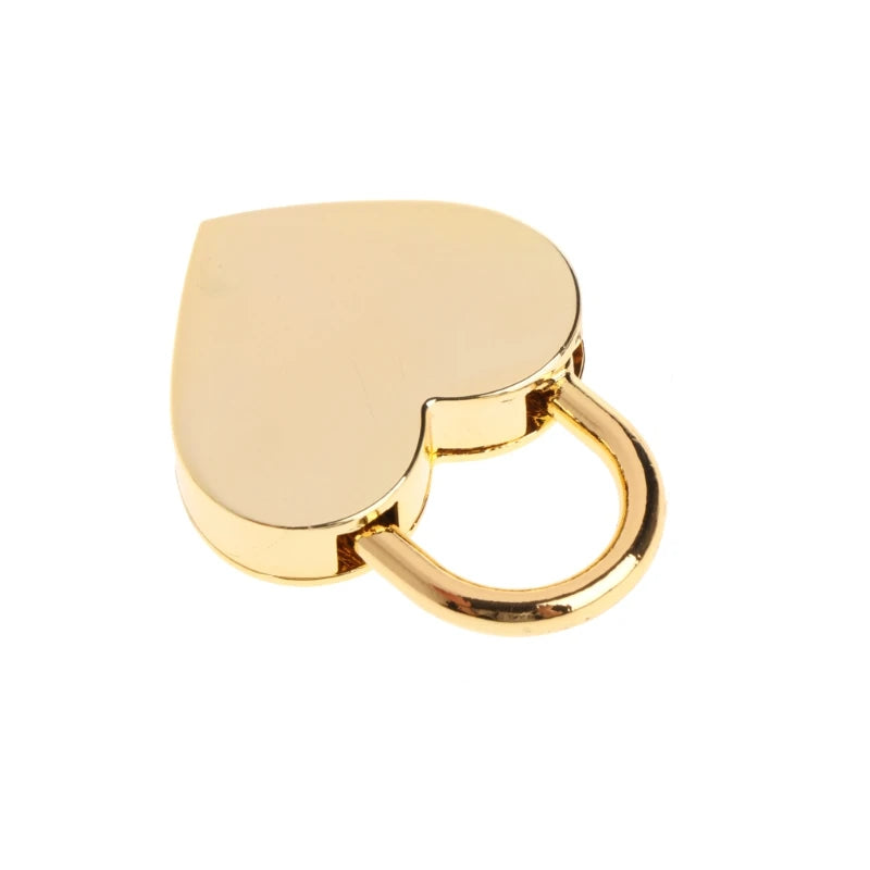 A vintage heart-shaped mini padlock with a gold finish and a circular key ring.