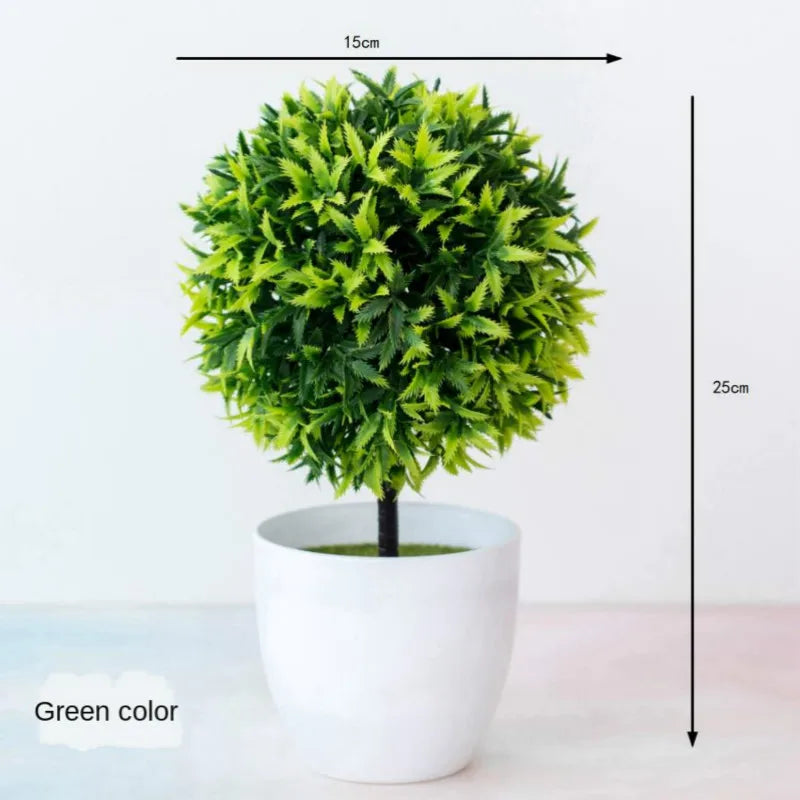 Artificial bonsai tree in a white pot with bright green foliage, shown against a white background.