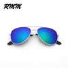 A pair of classic pilot sunglasses with blue and green mirror lenses and silver frames.