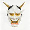A white Japanese Hannya demon mask with golden eyes and horns, featuring a menacing expression.