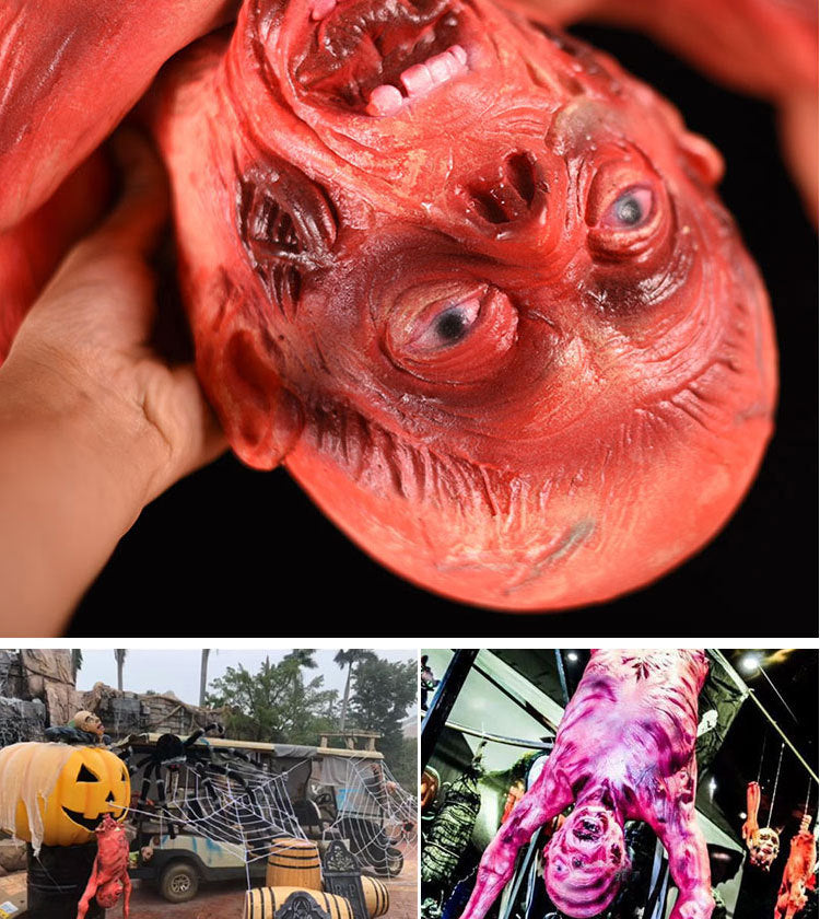 A close-up of a realistic, bloody prop of a severed head used for Halloween decor.