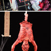 A realistic prop of a hanging corpse used for Halloween decor.