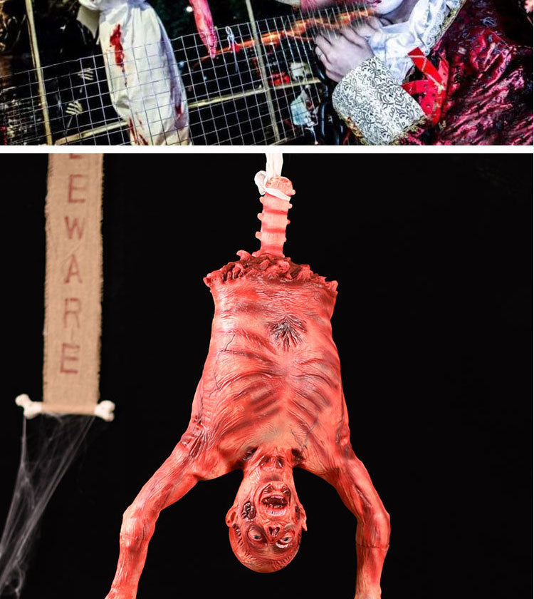 A realistic prop of a hanging corpse used for Halloween decor.