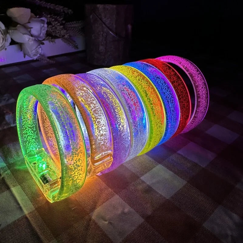 A stack of colorful, iridescent, circular wooden frames displayed on a dark surface.
