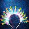 An LED glowing headband shaped like a bright, colorful flower or sunburst.