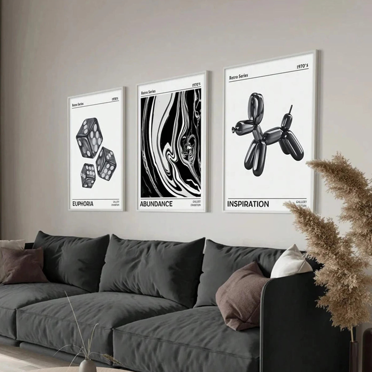 A set of three abstract puppy art canvas prints titled Euphoria, Abundance, and Inspiration displayed on a wall above a dark 