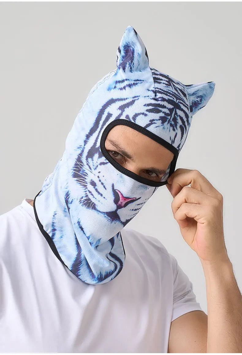 A person wearing a light blue tiger print balaclava mask with cat ears.