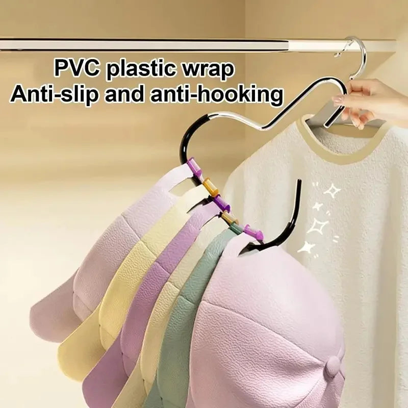 A set of five purple and pastel colored baseball caps are hanging on a PVC plastic wrap anti-slip and anti-hooking organizer.