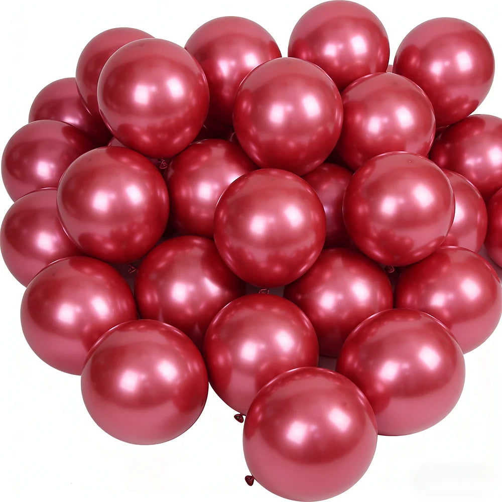 A pile of glossy rose gold chrome metallic balloons for celebrations.