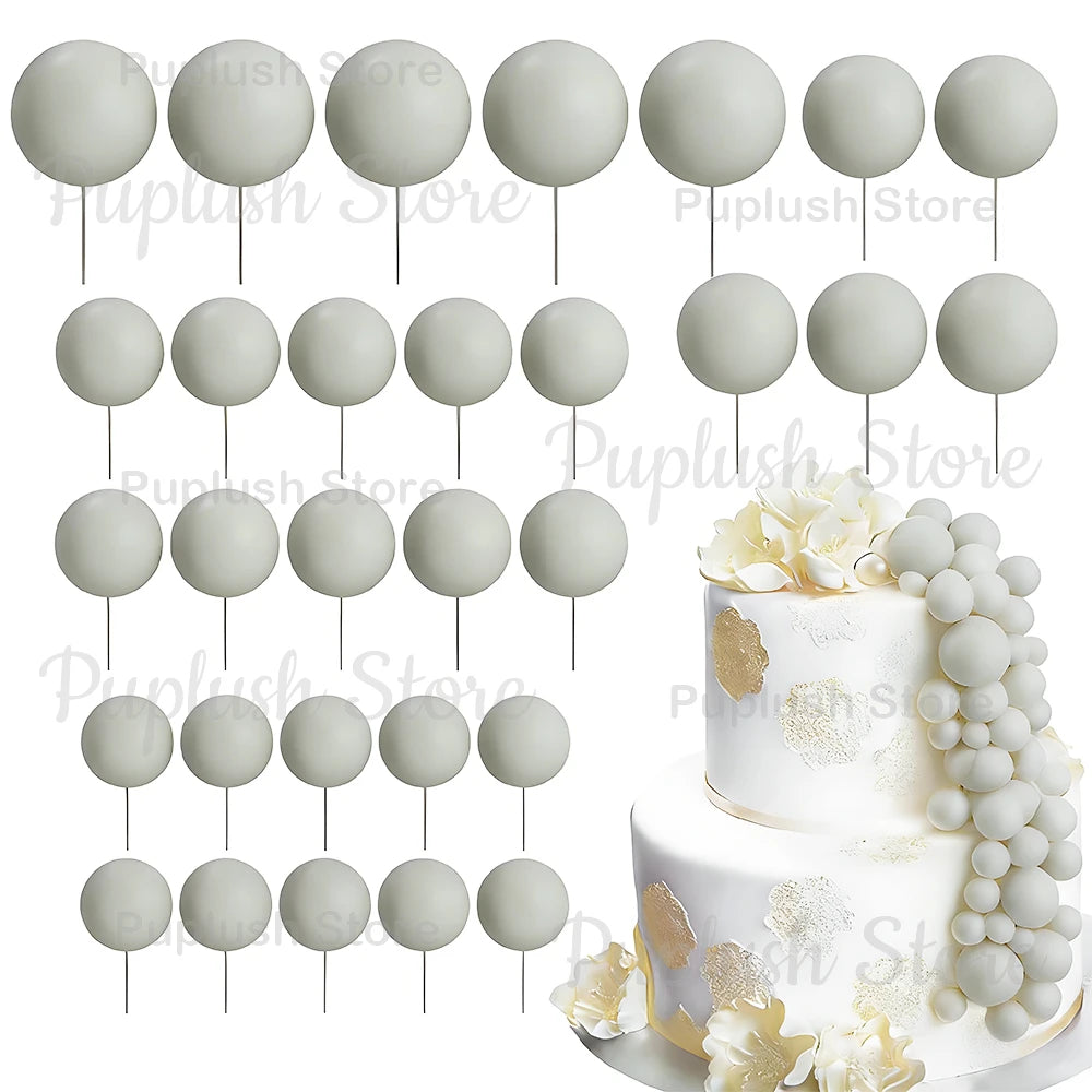 A set of white and light gray foam cake toppers on sticks for decoration.