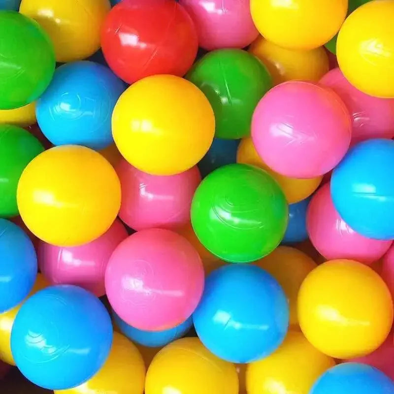 A pile of colorful, shiny plastic balls in various bright colors including yellow, green, pink, and blue.