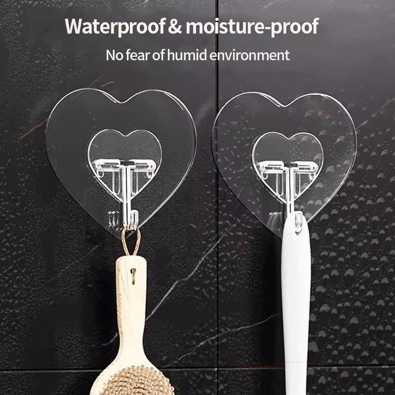 Transparent self-adhesive hooks with heart shapes attached to a wooden spoon and white handle