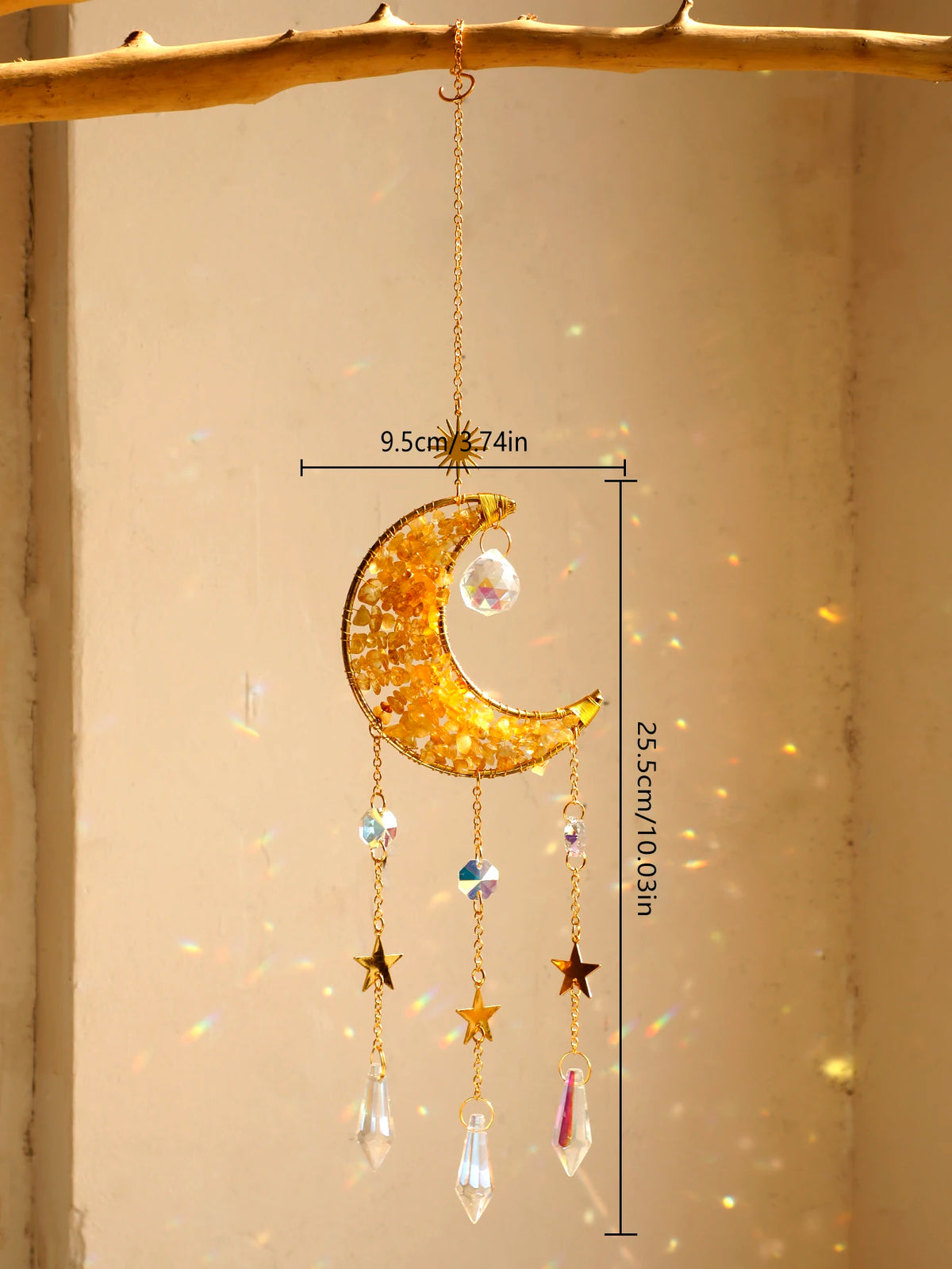 A hanging crystal dreamcatcher sun catcher featuring a golden crescent moon and dangling prism-cut crystals.