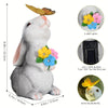 A gray rabbit statue with a yellow butterfly light, featuring an on/off button for the first use.