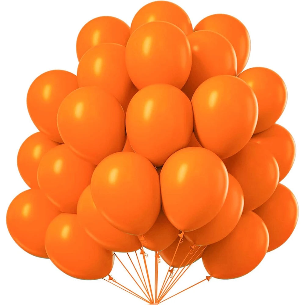 A bunch of bright orange latex balloons tied together for party decoration.