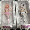 A set of two adorable cow-girl miniature figures in packaging.