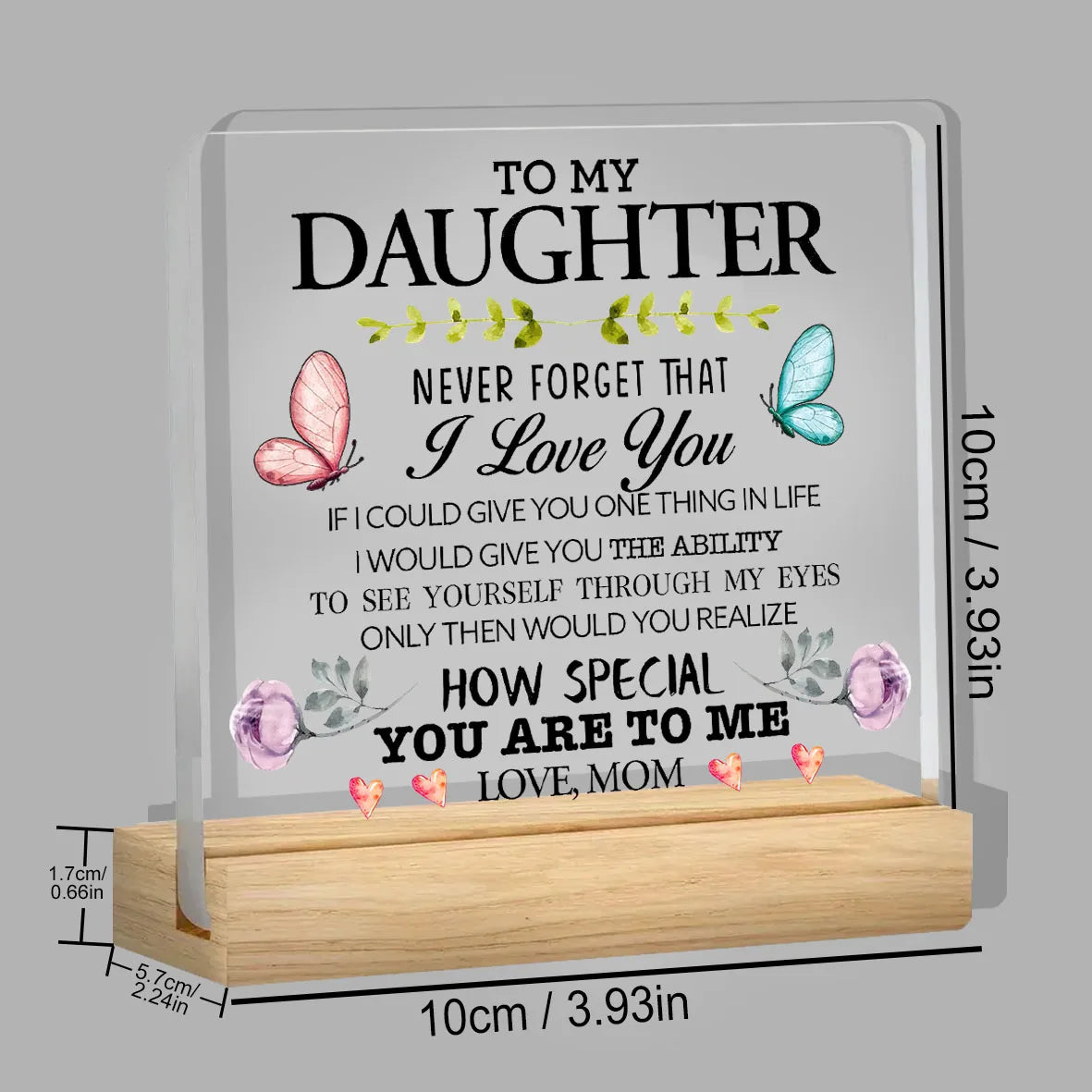 A clear acrylic desk sign with engraved text 'To my daughter I love you' and a message about seeing yourself through her eyes
