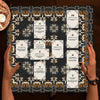 A dark altar cloth featuring an intricate Celtic cross pattern for tarot and divination