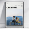 A canvas wall art poster featuring a photo of a couple sitting together against a scenic landscape.