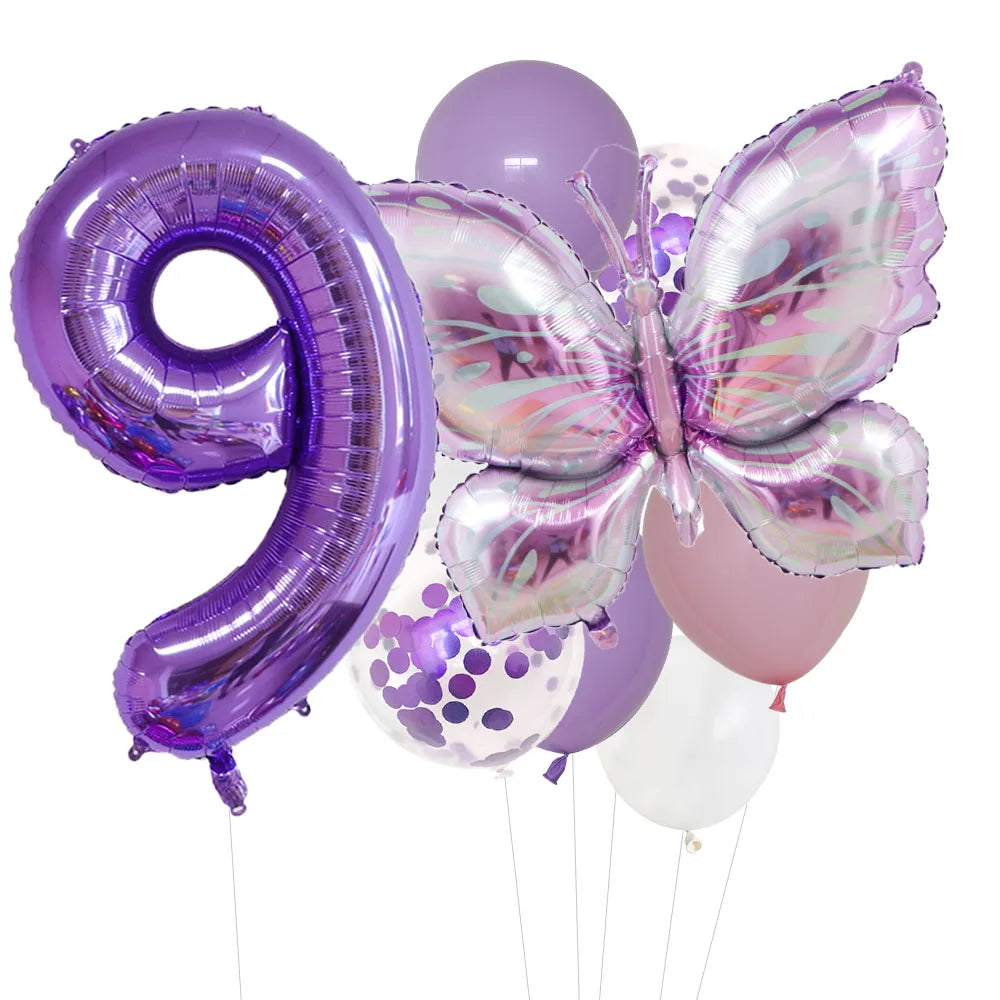 A set of purple foil balloons, including the number nine and a butterfly shape, in various shades of purple and pink.