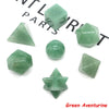 A collection of green aventurine crystals including geometric shapes and a round stone.