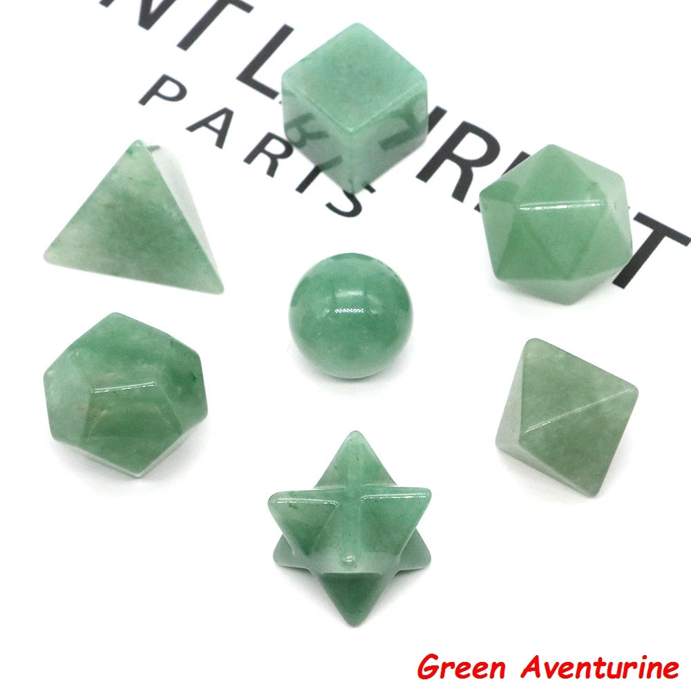 A collection of green aventurine crystals including geometric shapes and a round stone.