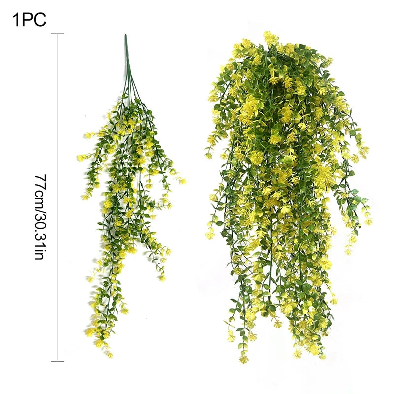 A long, cascading vine of yellow silk morning glory flowers used for home decor.