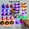 A hand demonstrates a set of 30 glow-in-the-dark Halloween wall stickers featuring various spooky silhouettes and designs.