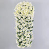 A vertical arrangement of artificial white violet ivy flowers used as a hanging garland for decor.