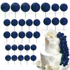 A set of dark blue and purple foam cake toppers on sticks for decoration.