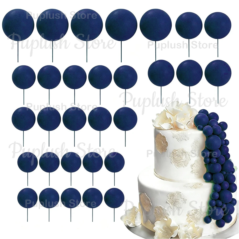 A set of dark blue and purple foam cake toppers on sticks for decoration.