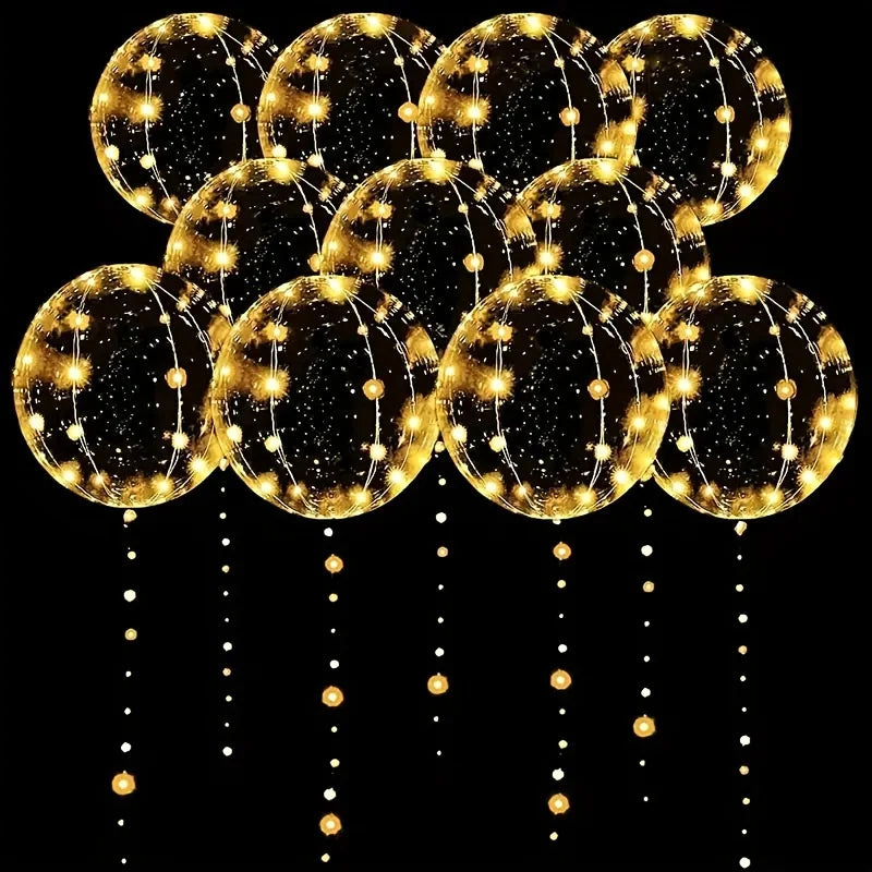 A cluster of golden LED illuminated balloon spheres used for party decor.