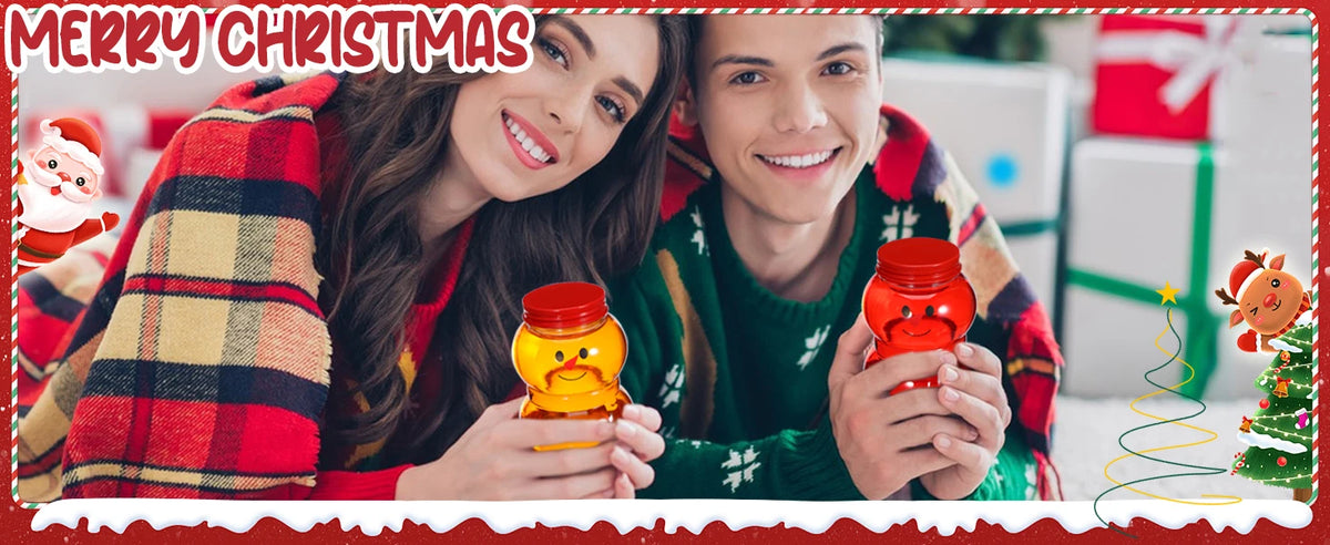Two people smiling while holding red candy jars with lids in a festive Christmas setting.
