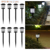 Eight black solar pathway lights with white illumination set for outdoor landscaping