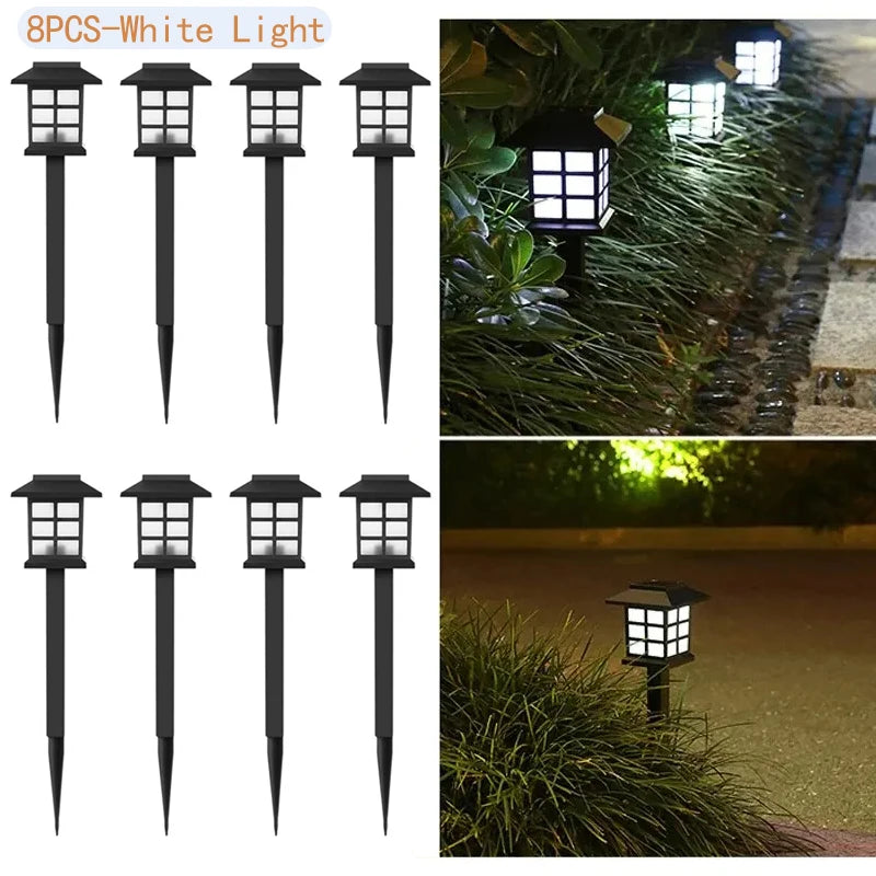 Eight black solar pathway lights with white illumination set for outdoor landscaping